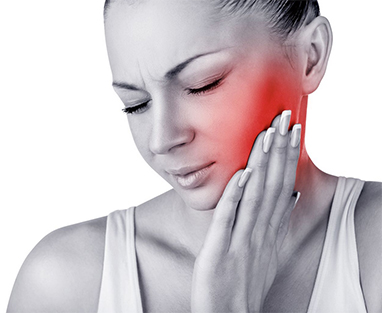 Patient holding her jaw due to dental pain